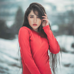 A photo of a beautiful foreign woman in a red dress